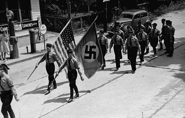 nazis-marching-with-their-swastika-flag-and-u-s-flag